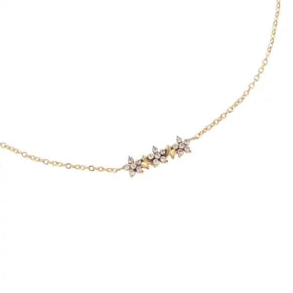Chaîne de cheville dorée Diamond Starfruit Trio Dottilove en acier inoxydable avec trois pendentifs étoiles en zirconium, 23cm + 5cm - Bijoux Les Trésors d'Emma 974 Réunion.